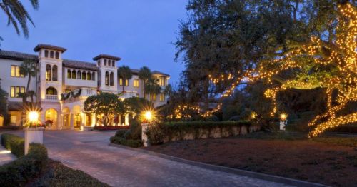 Views of Sea Island Resort, a Christmas-themed hotel, with dazzling holiday lights