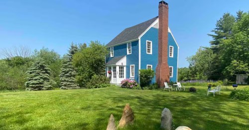Colonial home with blue exterior in Maine
