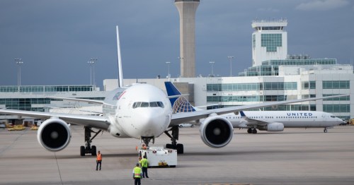 Airliner backing from gate at Denver International Airport