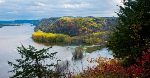 Views above Mississippi River and woodlands during autumn from Effigy Mounds National Monument in Iowa.
