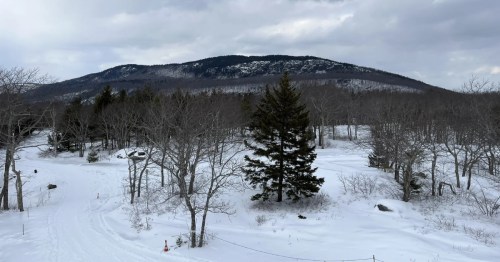 Hiking Mount Battie Trail in Maine during the winter