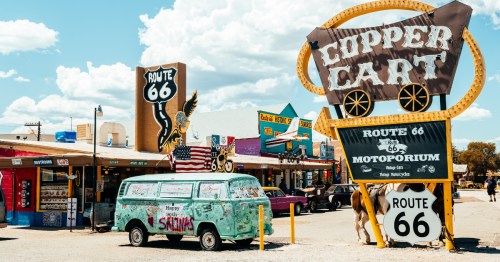 a vintage bus outside the copper cart along route 66 in seligman arizona