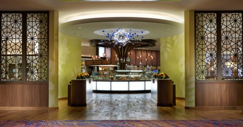 The exterior of a casino buffet, with a lobby leading to a round buffet spread.