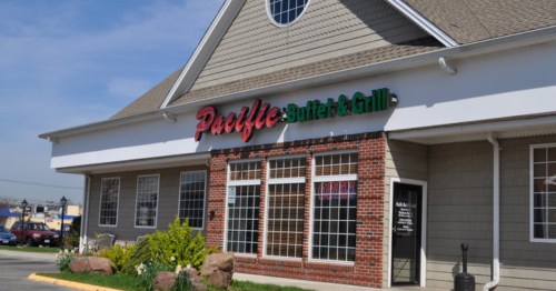 The exterior of a stand-alone restaurant reading "Pacific Buffet and Grill"
