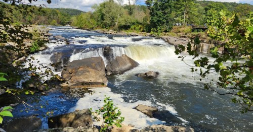 Rushing water and rapids on the Youghiogheny River along Ferncliff Trail in Ohiopyle State Park.