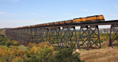 The massive iron spans of the historic Hi-Line Railroad Bridge stretching across the Sheyenne River Valley.
