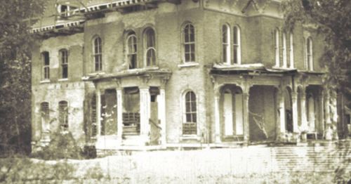 An old photograph of a mansion.