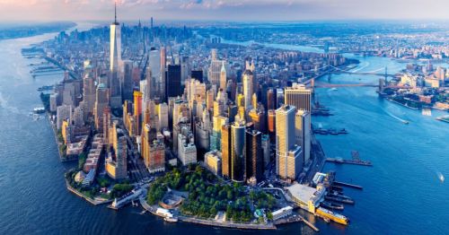 An aerial shot of the New York skyline showcasing many New York City high-rise buildings.