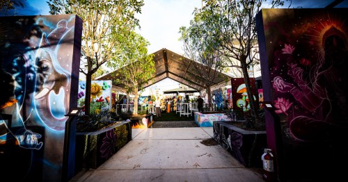 view of an open structure with a roof that's part of the pemberton, an outdoor venue with bars and local art in downtown phoenix arizona
