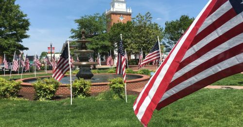 American flags in a town square.