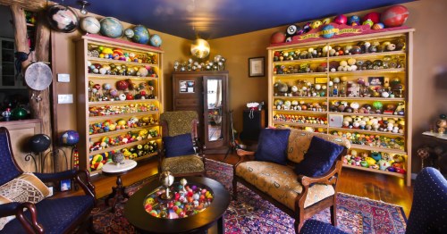 An overview of the main room in the Ozark Ball Museum, with furniture in the center
