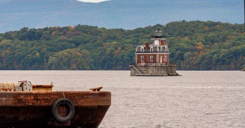 A calming mage of theHudson Athens Lighthouse perched on an island, in Athens, New York.
