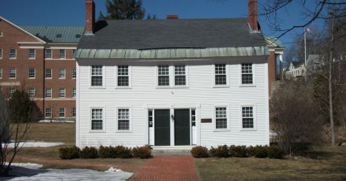A historical white wooden house.