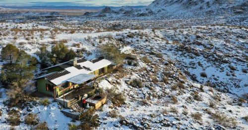 A home in a snowy desert.