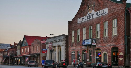 Downtown Hermann at dusk with brick buildings lining the street