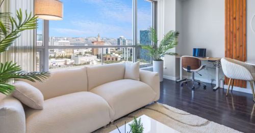 A living room with large windows.