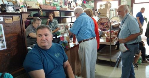 People sitting inside a burger joint.