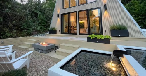 An A-Frame cabin in North Carolina with a water feature and a fire pit.