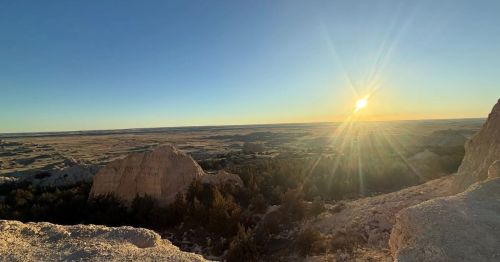 View of a canyon at sunset in Badlands National Park.