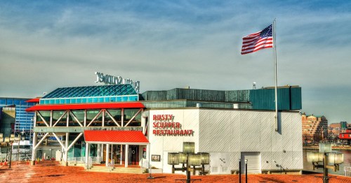exterior of the rusty scupper, a landmark restaurant at the harbor in baltimore maryland