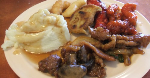 Mashed potatoes, chicken, and dumplings on a plate at World Buffet.
