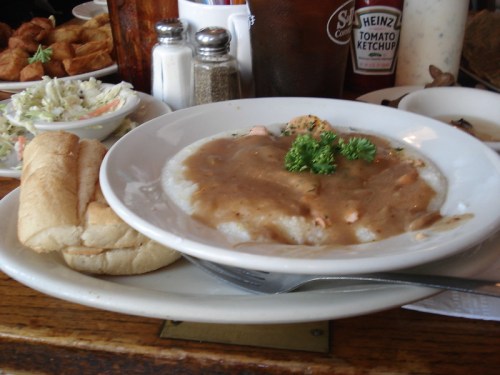A plate of Shrimp, Gravy, and Grits at Hyman's Half Shell Seafood in Charleston.