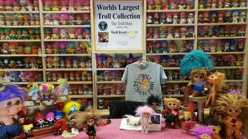 Rows of troll dolls in museum exhibit
