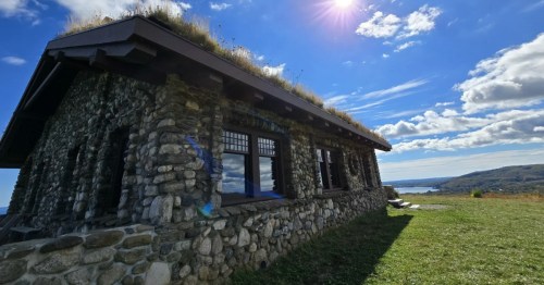 A quirky stone hut built in 1913, topped with a grass roof and situated on cliffs above the Atlantic.