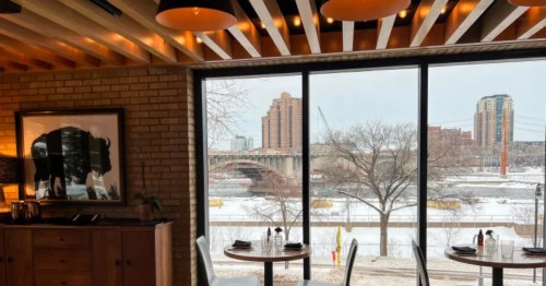 View of Minneapolis from inside the dining room at Owamni Restaurant