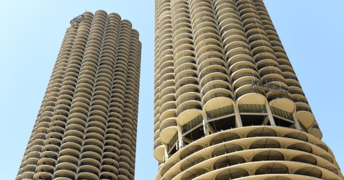 Two towers shaped like corncobs stand against a blue sky.