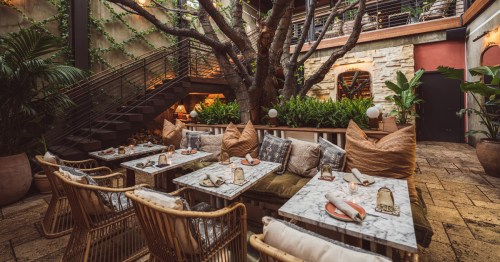 The outdoor patio area of Mirate, a cozy restaurant in Los Angeles.