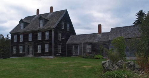 A weathered grey farmhouse famously depicted in Andrew Wyeth's painting, "Christina's World".