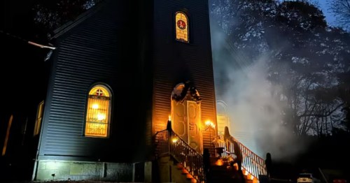 Black Abbey church Airbnb in Mill River, MA; a moody Nordic-inspired Norway dupe with glowing stained glass.