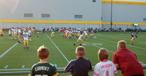 Children watching a football game in Wisconsin