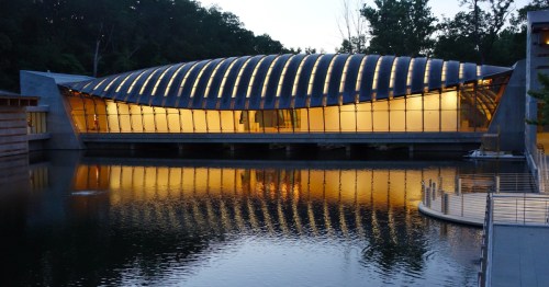 exterior of the main crystal bridges museum building in the evening in arkansas