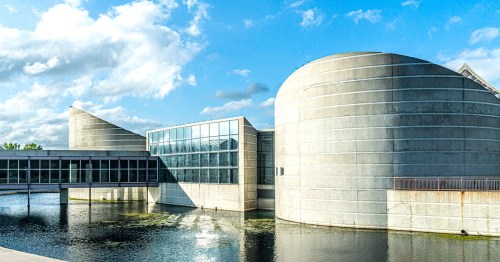 The modern curved architecture of the Exploration Place science museum in Wichita, Kansas.