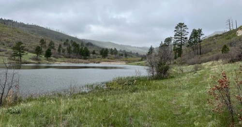 view of river and mountains in sugarite canyon state park in nm