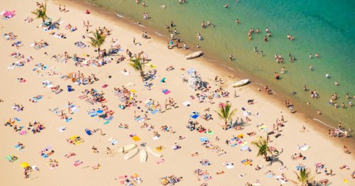 Oak Street beach with Lake Michigan, aerial view, people enjoying the sunny summer day outdoors, Chicago, Illinois