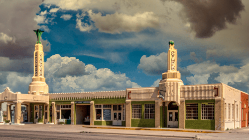 exterior of Conoco Tower Station and U Drop Inn Cafe, Shamrock, TX under clouds