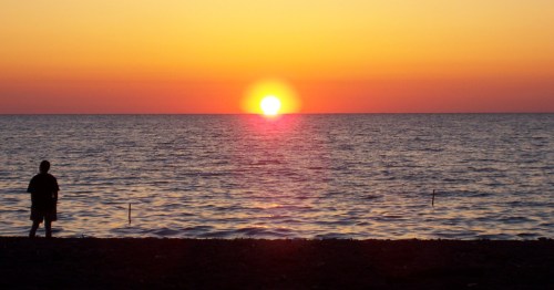 Sunset over Lake Erie at Freeport Beach in North East, Pennsylvania.