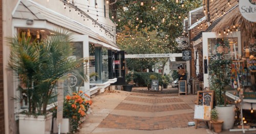 charming pedestrian alley with hanging string lights and boutique shops in Doylestown, Pennsylvania.