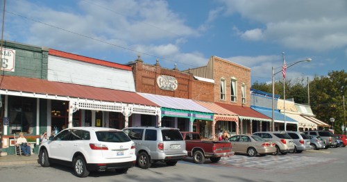 Stretch of brick shops and colorful awnings in downtown Bell Buckle, TN.