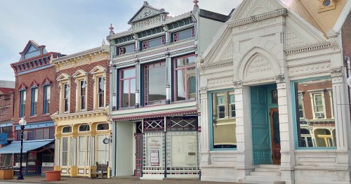 Historic 19th-century colorful storefronts in the charming downtown of New Harmony, Indiana.