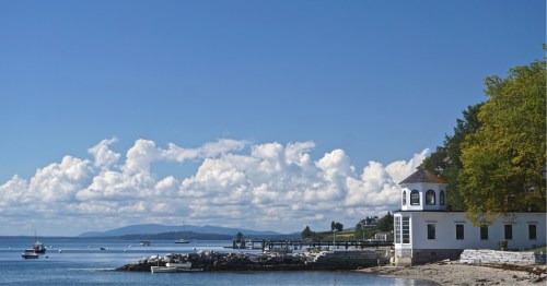 Beautiful view of the harbor as seen from Castine, Maine under a bright blue summer sky
