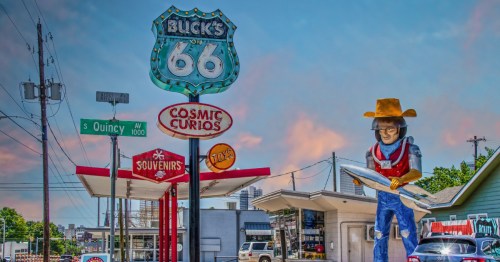 Curio and Souvenir Shop along Route 66 in Tulsa Oklahoma featuring statue of space cowboy holding rocket created from retro gas