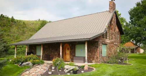 The exterior of a small cabin near Valentine, Nebraska, on a sunny summer day.