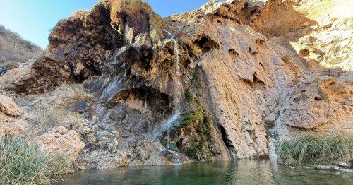 the double cascade of sitting bull falls cascades into a pool of water near carlsbad nm