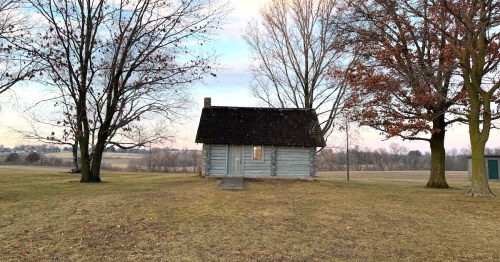 The replica of the Little House in the Big Woods log cabin sits in a clearing near Pepin, Wisconsin.