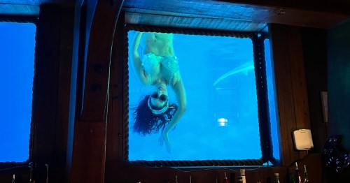 Mermaid hanging upside down at the Wreck Bar in Fort Lauderdale