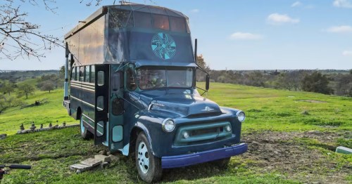The exterior of a blue bus that's been renovated into a unique vacation rental in Northern California.